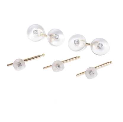 Cartier cufflinks and shirt studs in gold and platinum with rock crystals and diamonds.