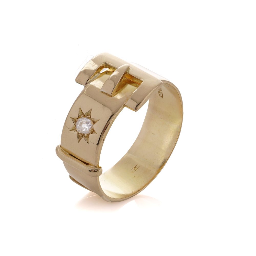 Antique men's belt buckle gold ring accented a diamond.