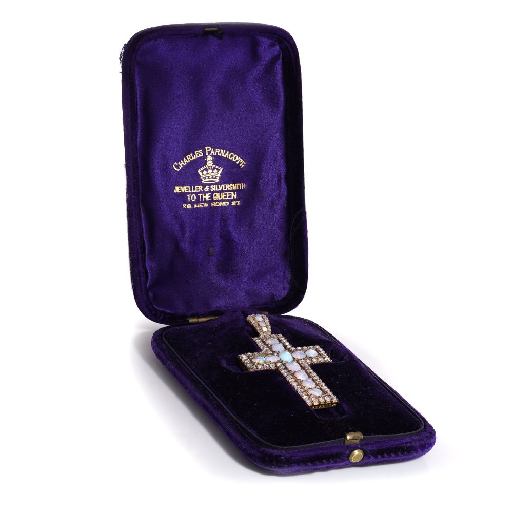 Antique 20 gold cross pendant set with diamonds and opals.