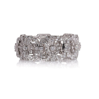 Platinum and diamond floral design link bracelet.