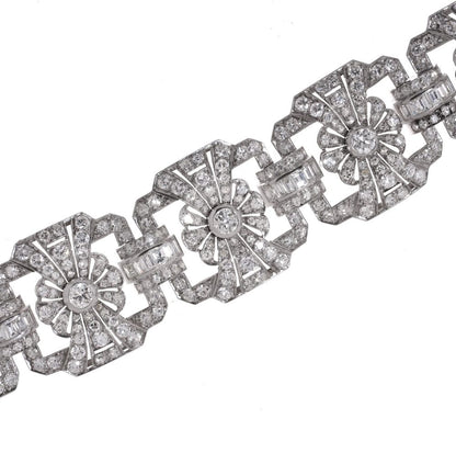 Platinum and diamond floral design link bracelet.