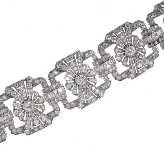 Platinum and diamond floral design link bracelet.