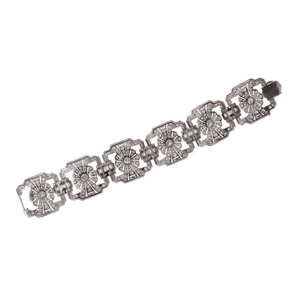 Platinum and diamond floral design link bracelet.