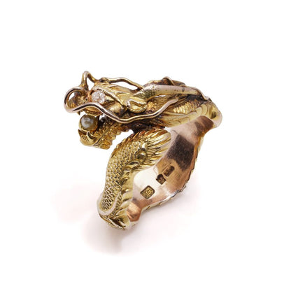 Chinese gold men's dragon ring set with diamond and pearl.