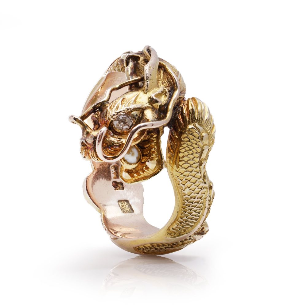 Chinese gold men's dragon ring set with diamond and pearl.