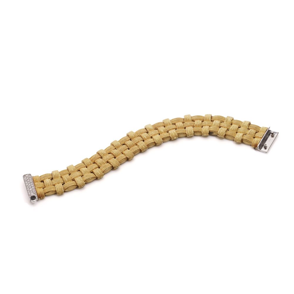 Woven design bracelet in white and yellow gold with diamonds and ruby,