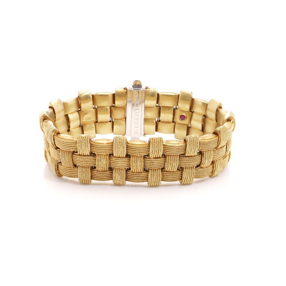 Woven design bracelet in white and yellow gold with diamonds and ruby,