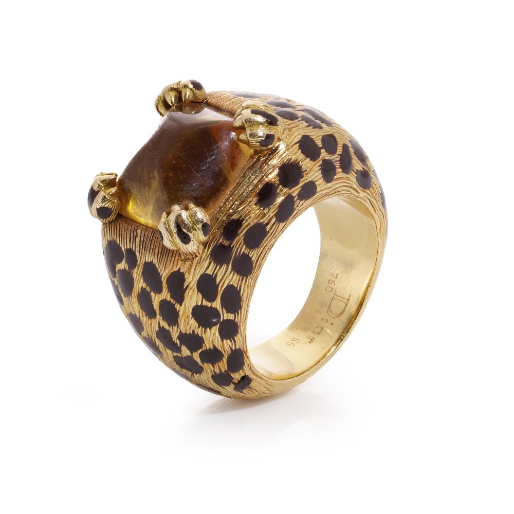 Dior cocktail ring with a sugarloaf cabochon-cut citrine, held by paw prongs in gold with black enamel leopard spots.