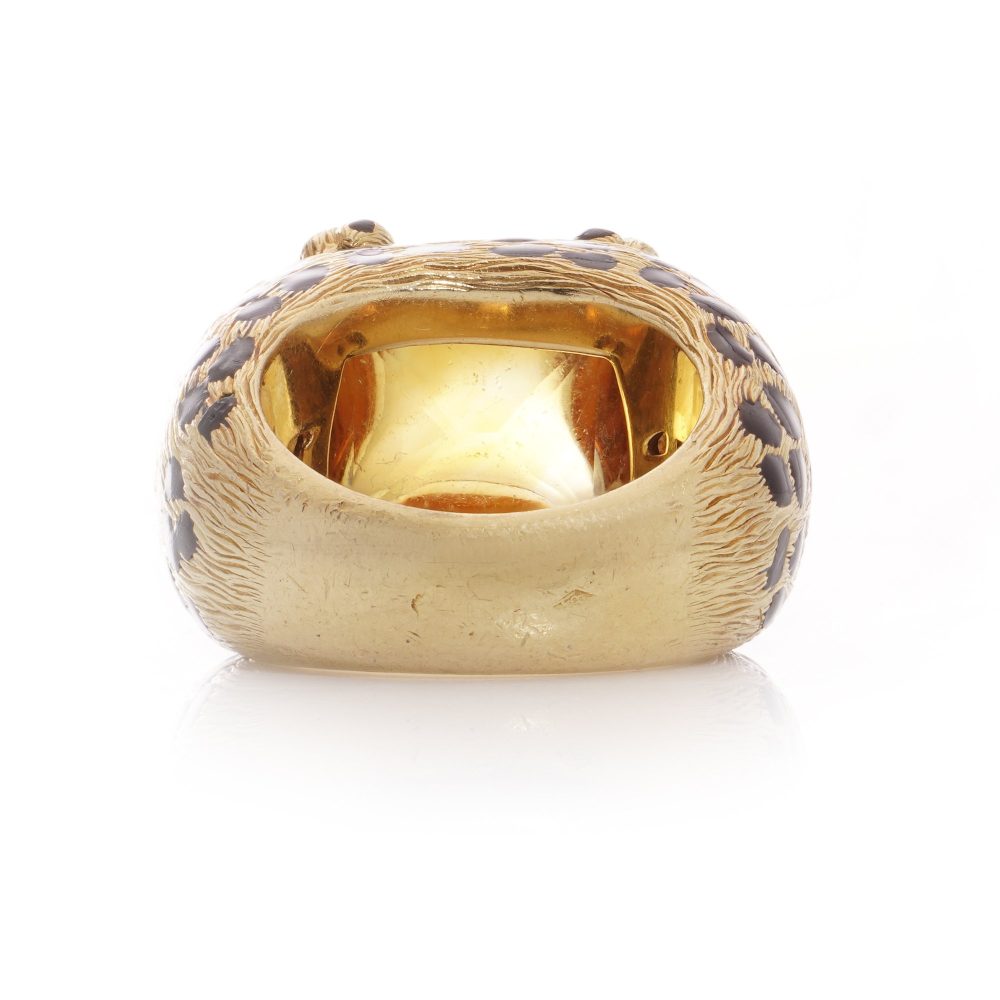 Dior cocktail ring with a sugarloaf cabochon-cut citrine, held by paw prongs in gold with black enamel leopard spots.