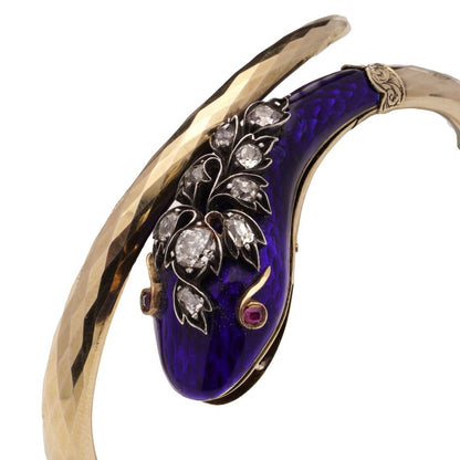 Gold and silver snake serpent bangle with diamonds.