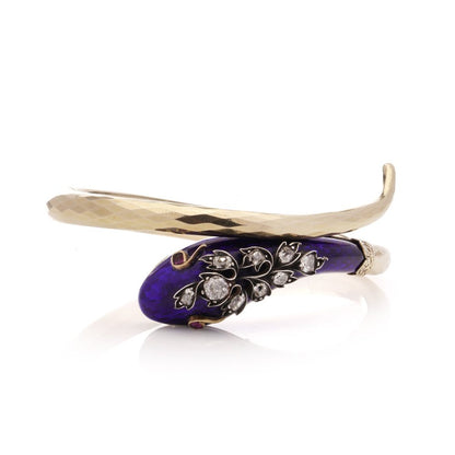 Gold and silver snake serpent bangle with diamonds.
