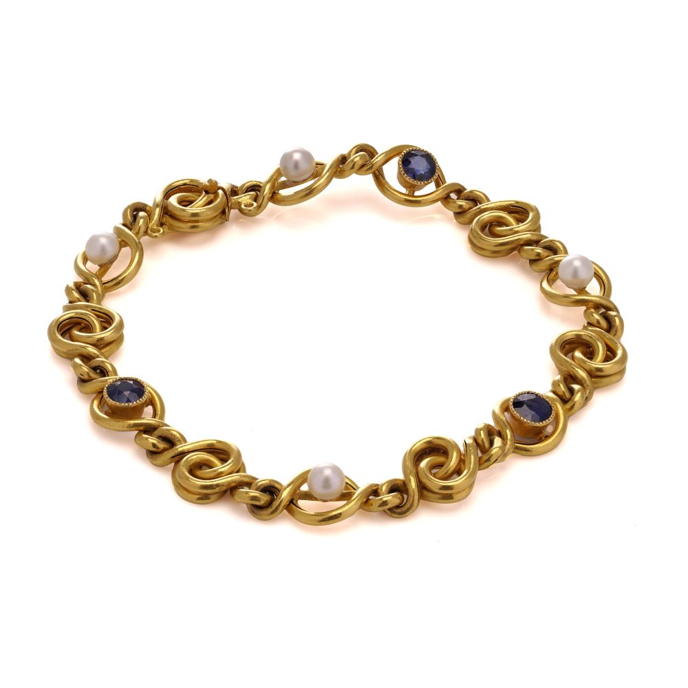 Antique sapphire and pearl bracelet in 24 carat gold.