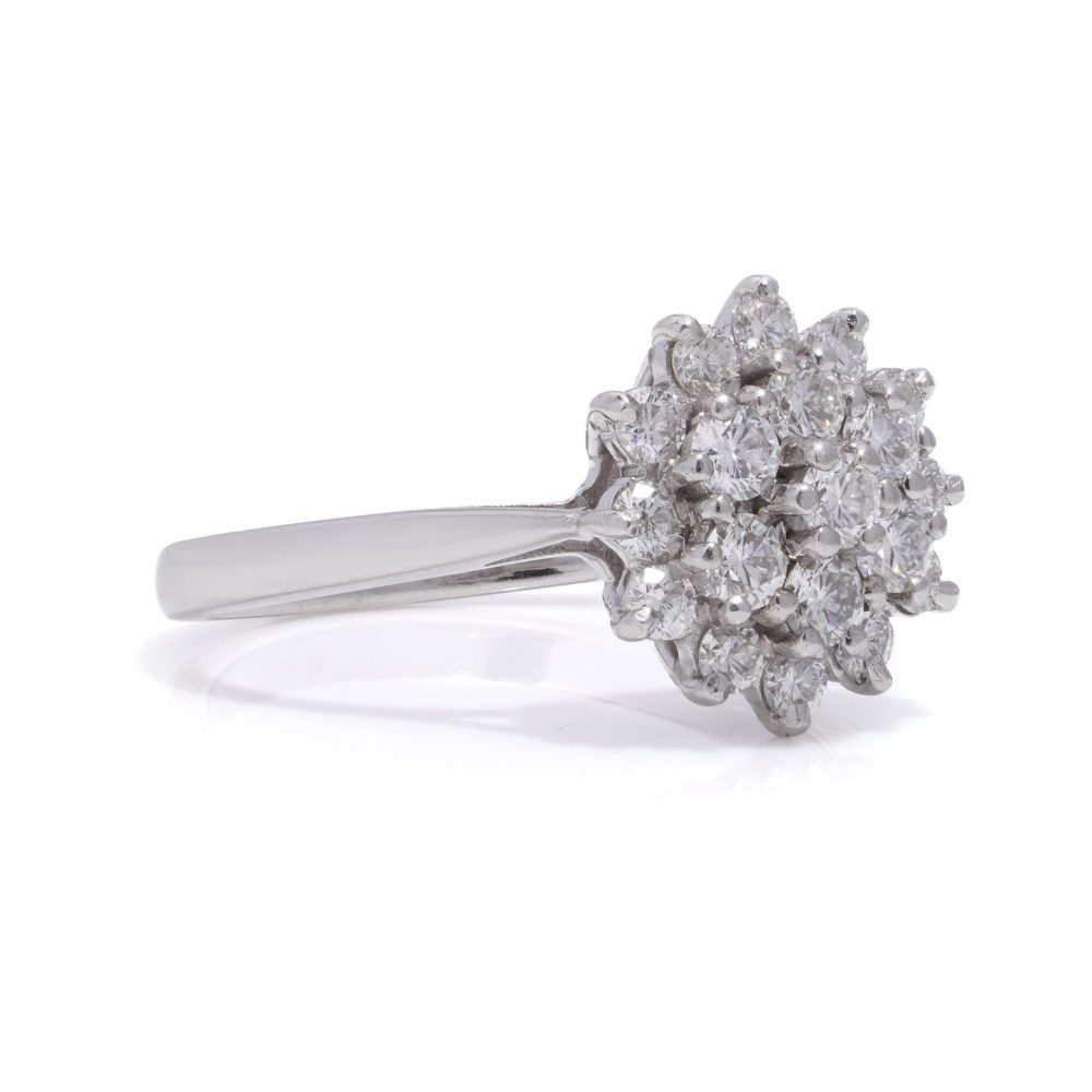 Vintage white gold flower head diamond cluster ring.