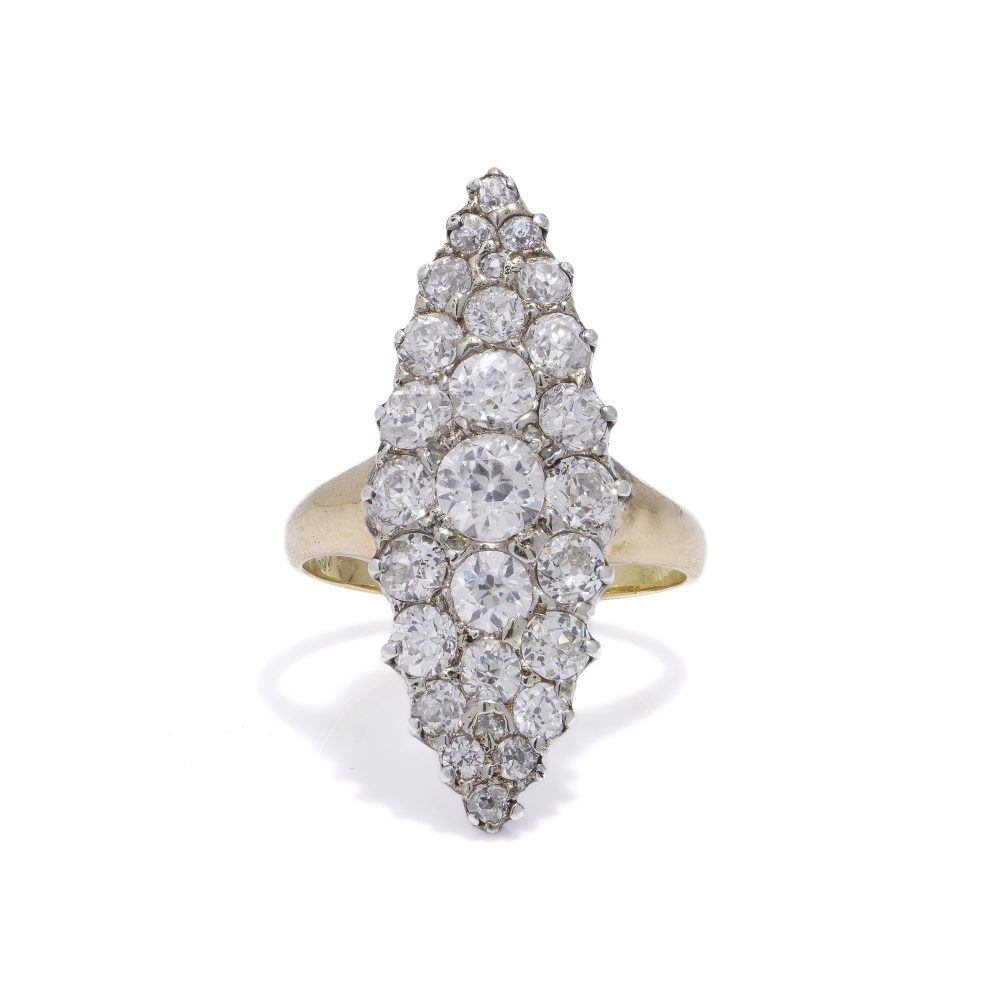 Antique diamond cluster ring in gold and silver.