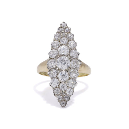 Antique diamond cluster ring in gold and silver.