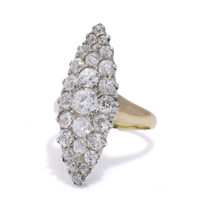 Antique diamond cluster ring in gold and silver.