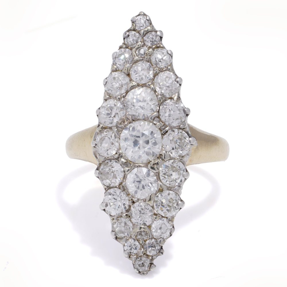 Antique diamond cluster ring in gold and silver.