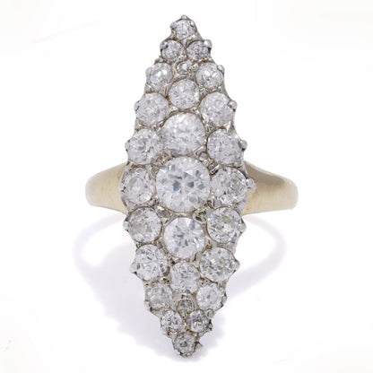 Antique diamond cluster ring in gold and silver.