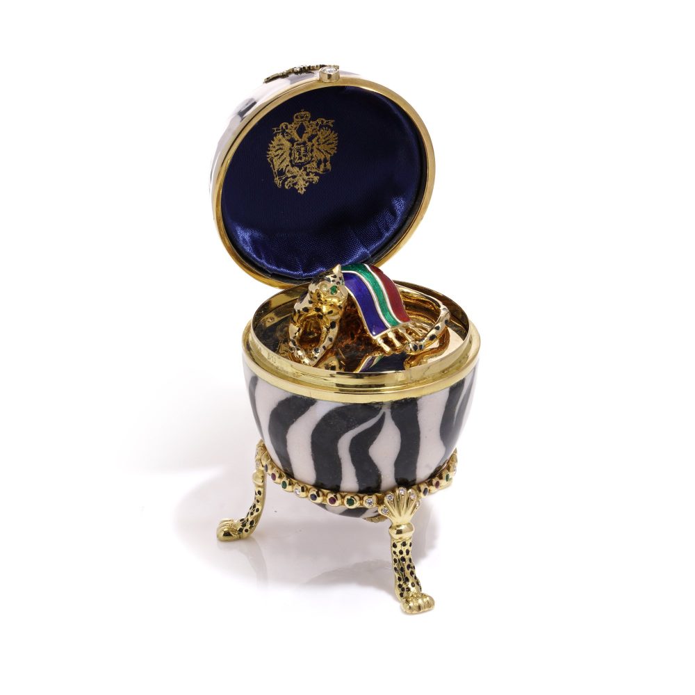 Faberge limited edition gold and enamel egg with gemstones.