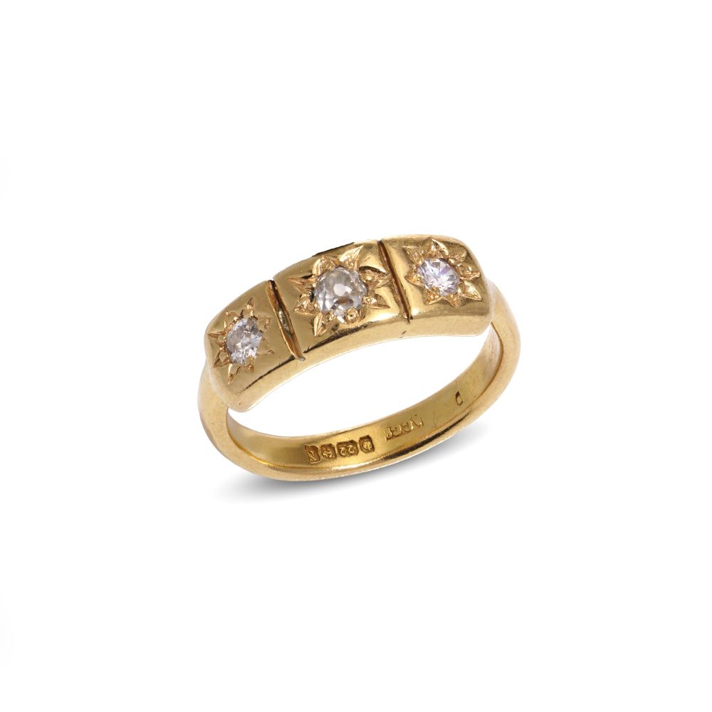 Vintage three-stone diamond ring in gold.