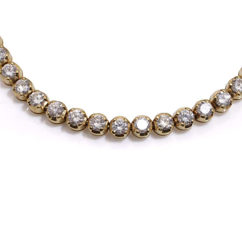 Gold tennis bracelet set with 6.30 carats of diamonds.