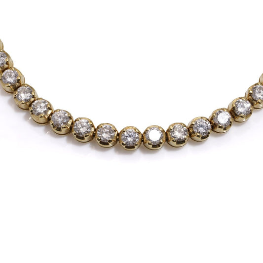 Gold tennis bracelet set with 6.30 carats of diamonds.
