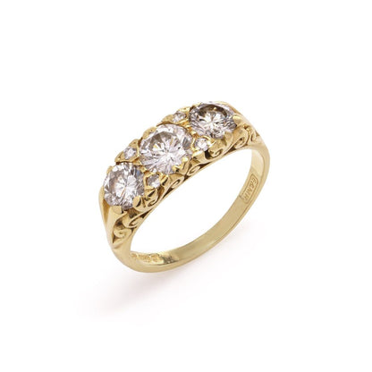 Three stone diamond ring in yellow gold