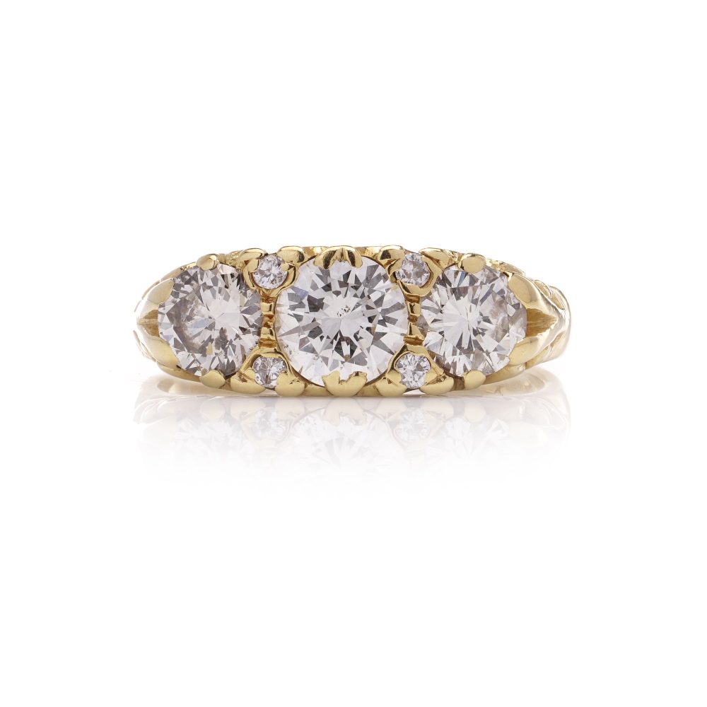 Three stone diamond ring in yellow gold