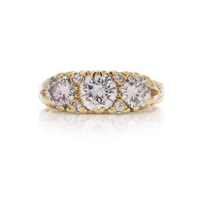 Three stone diamond ring in yellow gold