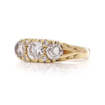 Three stone diamond ring in yellow gold