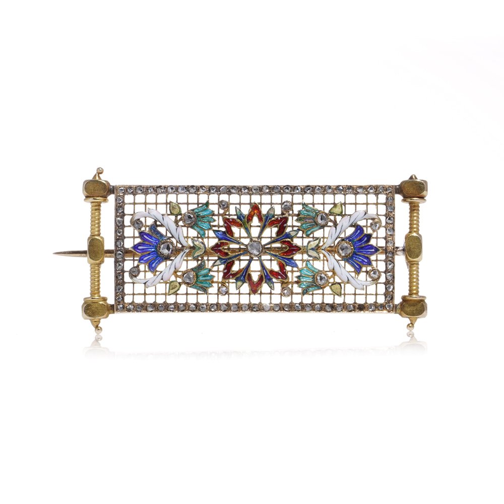 Lingerie pin brooch in gold with enamel and diamonds.