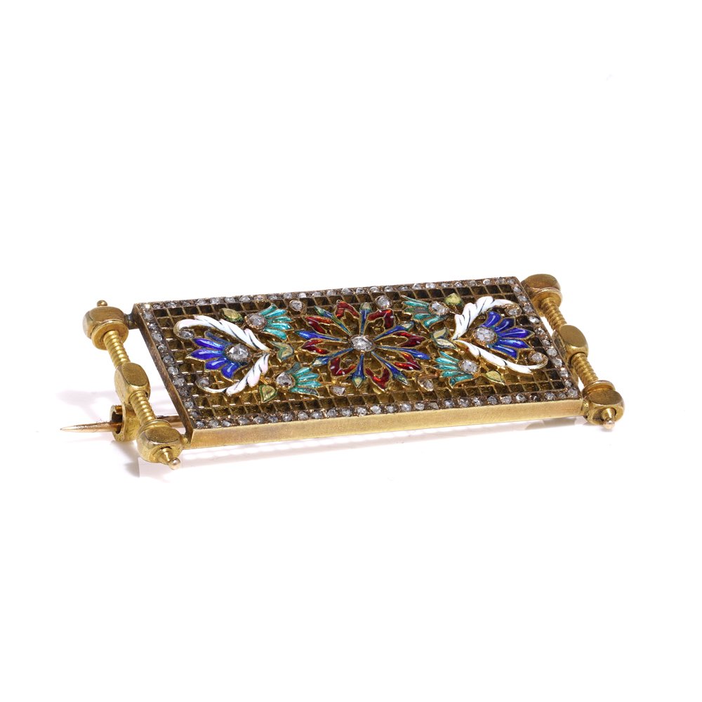 Lingerie pin brooch in gold with enamel and diamonds.