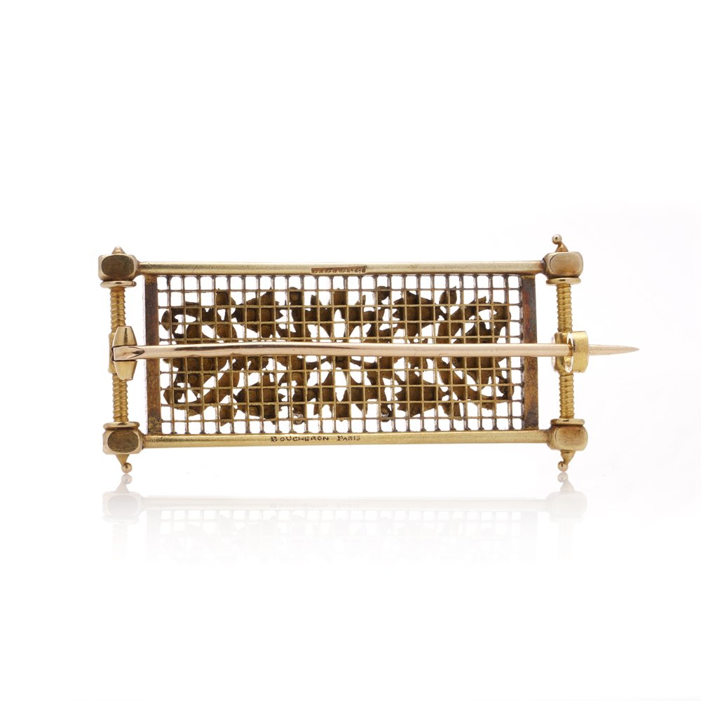 Lingerie pin brooch in gold with enamel and diamonds.