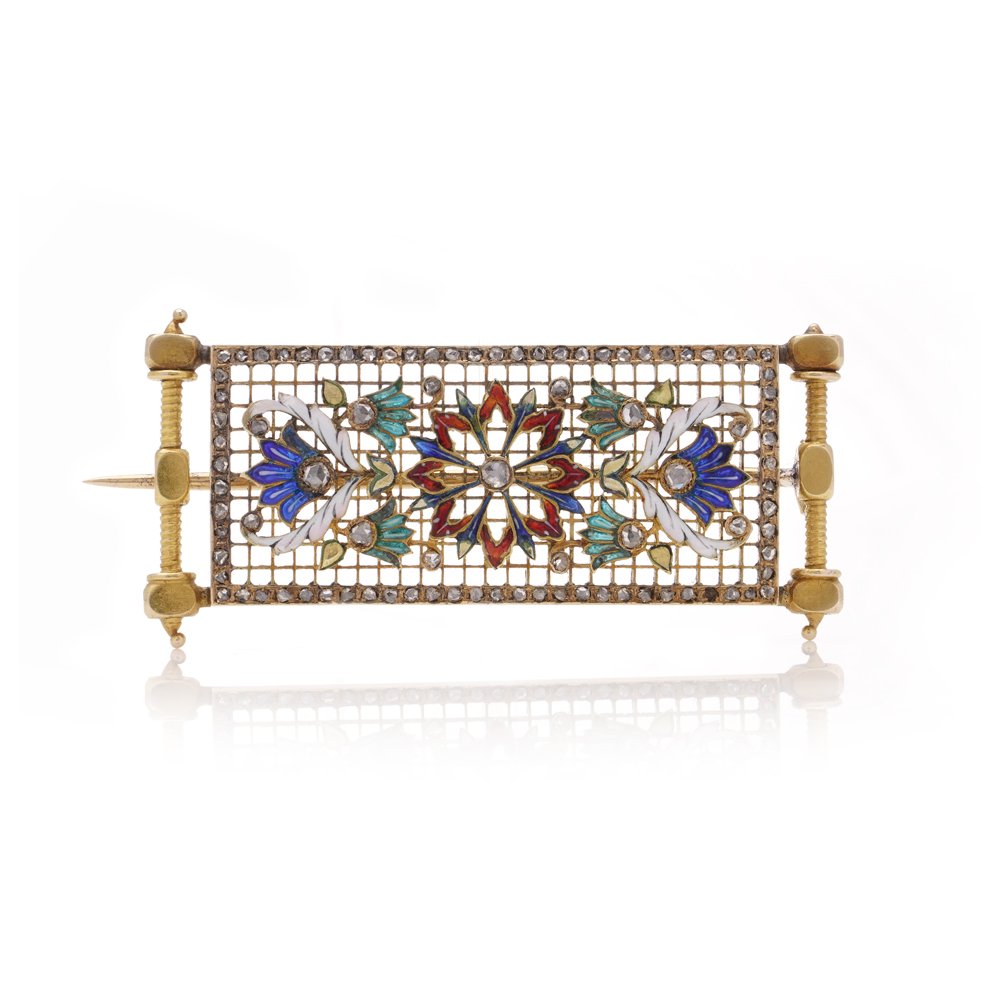 Lingerie pin brooch in gold with enamel and diamonds.