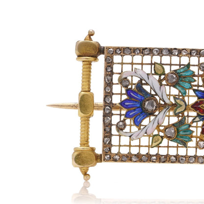 Lingerie pin brooch in gold with enamel and diamonds.
