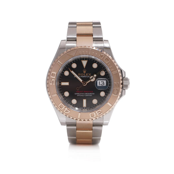 A Rolex Yacht-Master black dial wristwatch in steel and rose gold, on a white background