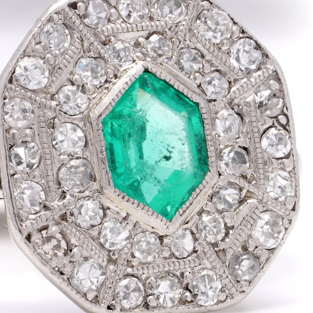 Art Deco emerald and diamond cluster ring in white gold.