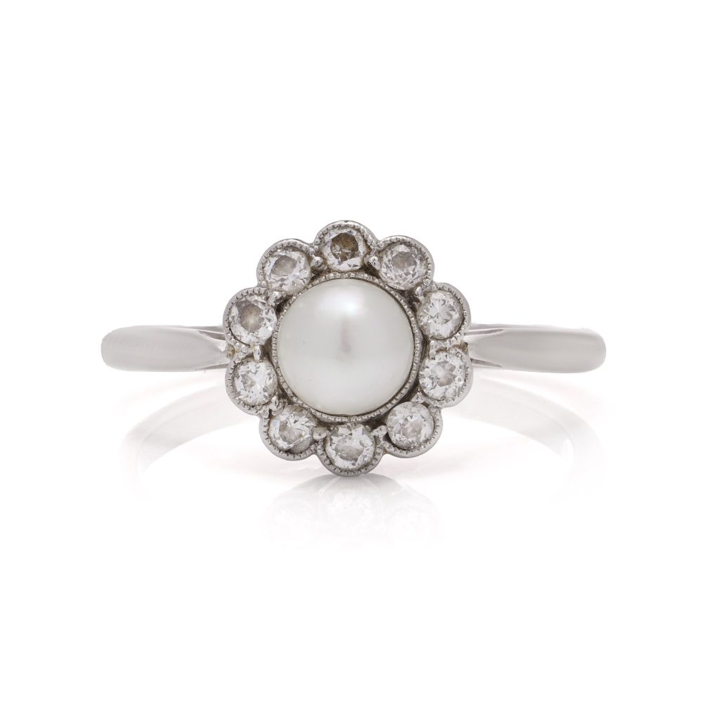 Diamond and pearl cluster ring in platinum and gold.