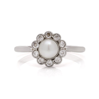 Diamond and pearl cluster ring in platinum and gold.