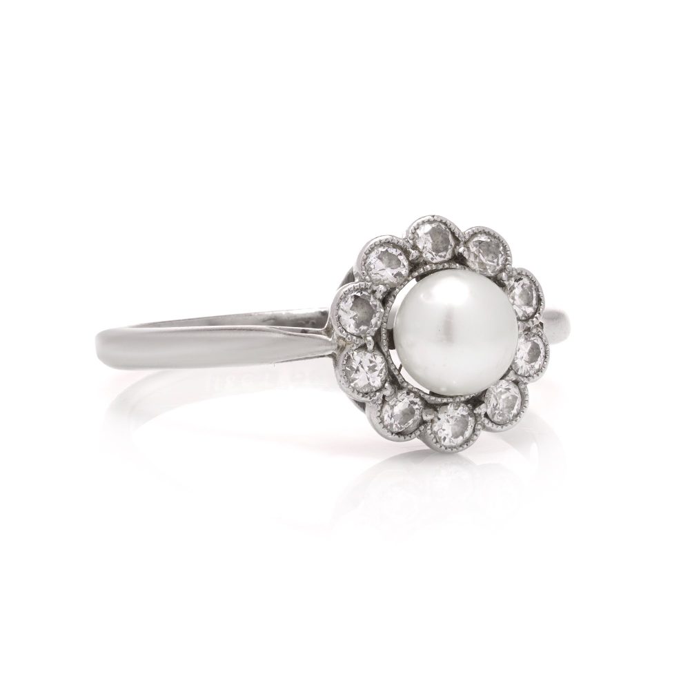 Diamond and pearl cluster ring in platinum and gold.