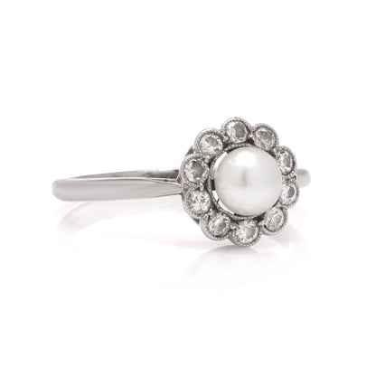 Diamond and pearl cluster ring in platinum and gold.
