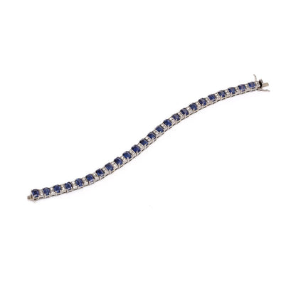 Sapphire and diamond link bracelet in white gold.