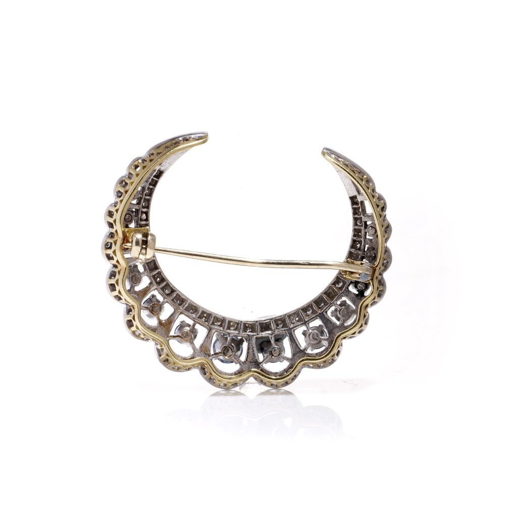 Edwardian sapphire and diamond crescent brooch in gold 