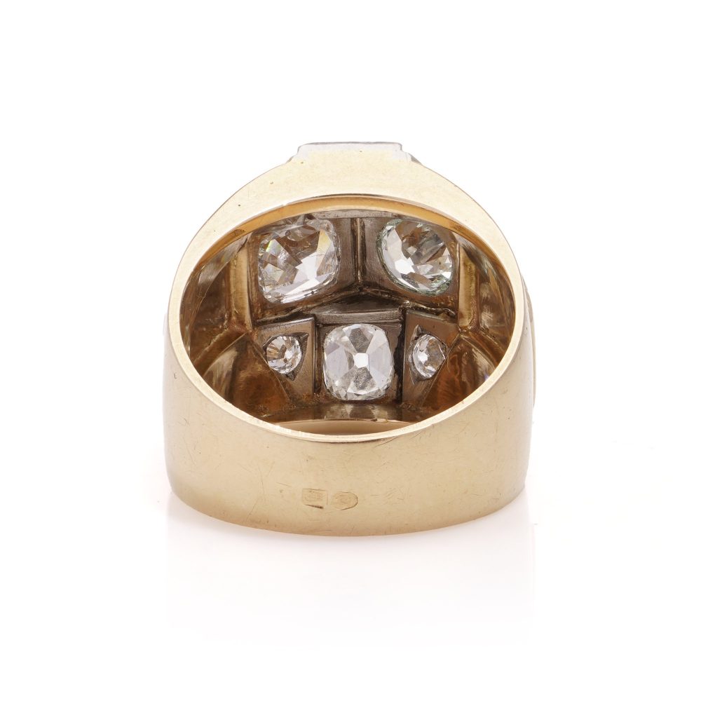 Diamond dome ring in gold and platinum. 