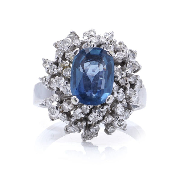 Sapphire and diamond cluster ring in white gold. 