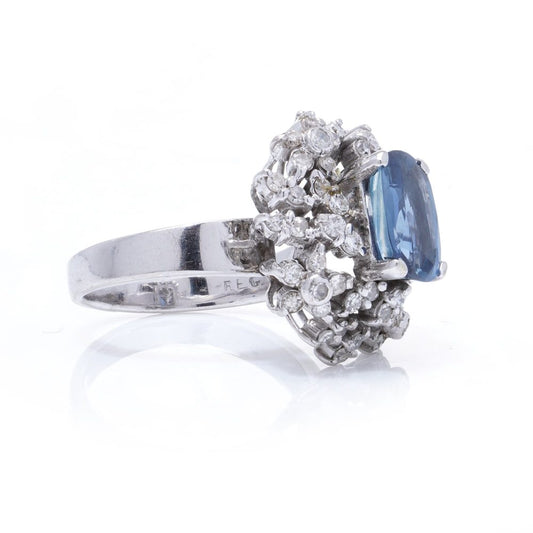 Sapphire and diamond cluster ring in white gold. 