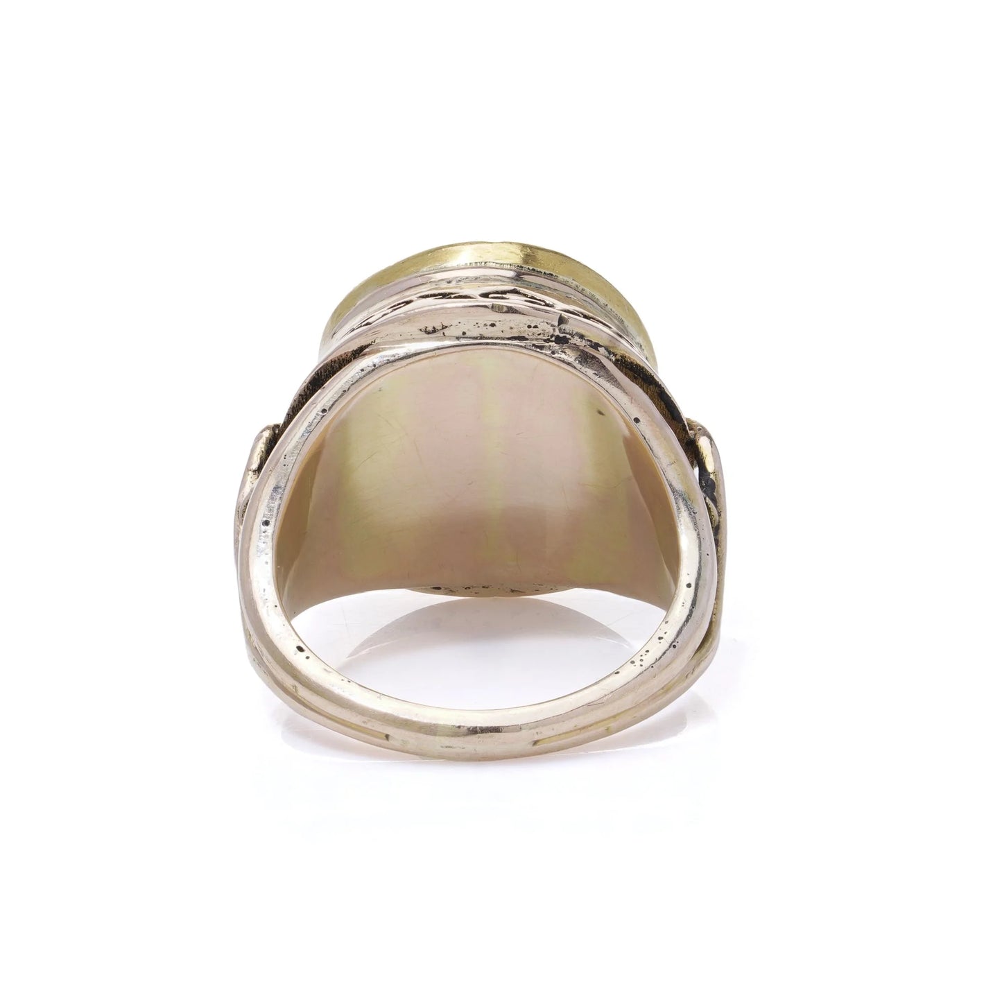 A ring in yellow and rose gold, on a white background