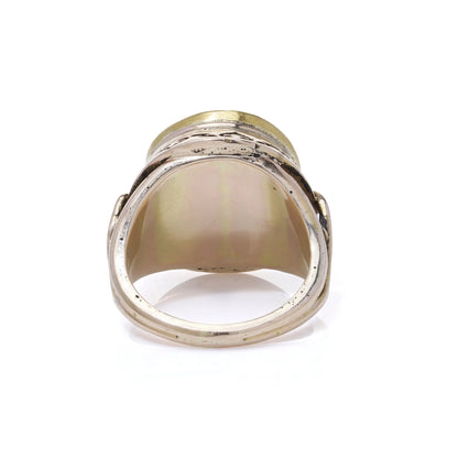 A ring in yellow and rose gold, on a white background