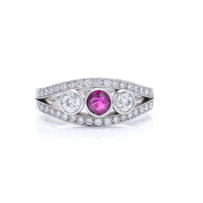 Platinum three stone diamond and ruby ring.