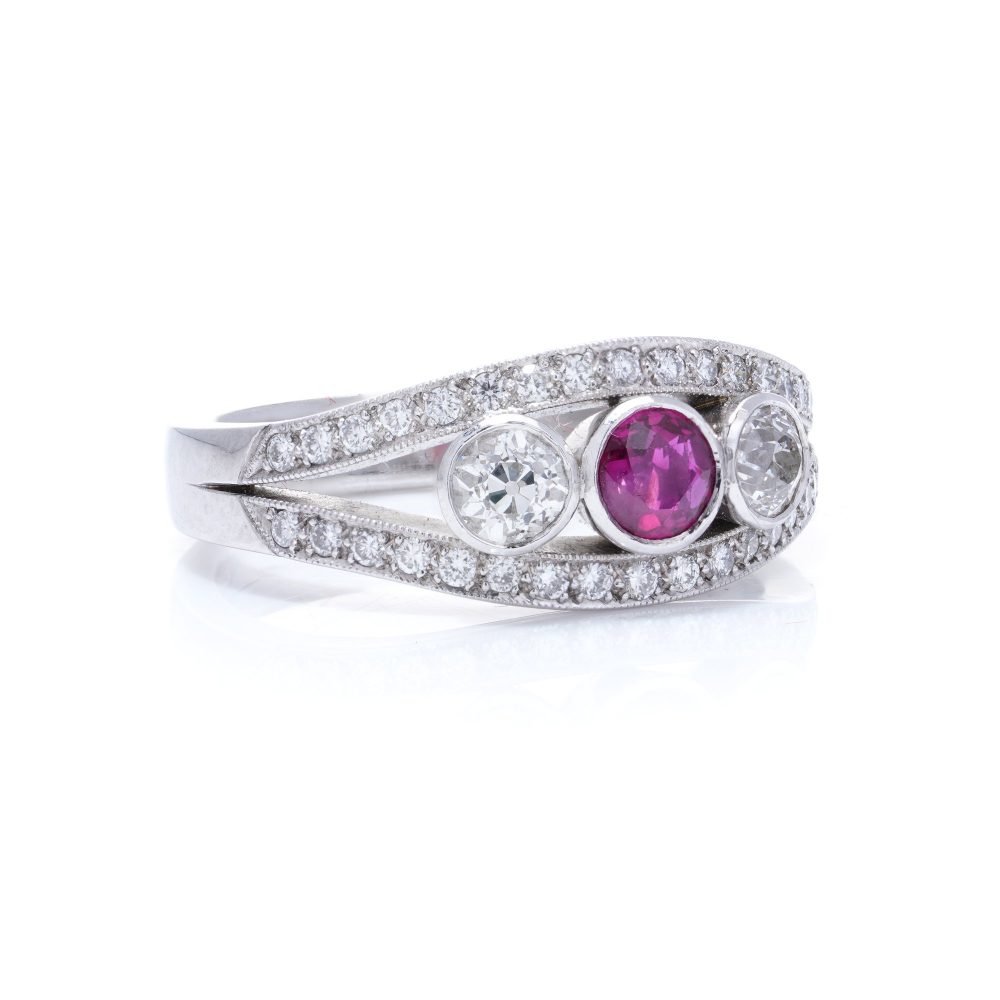 Platinum three stone diamond and ruby ring.